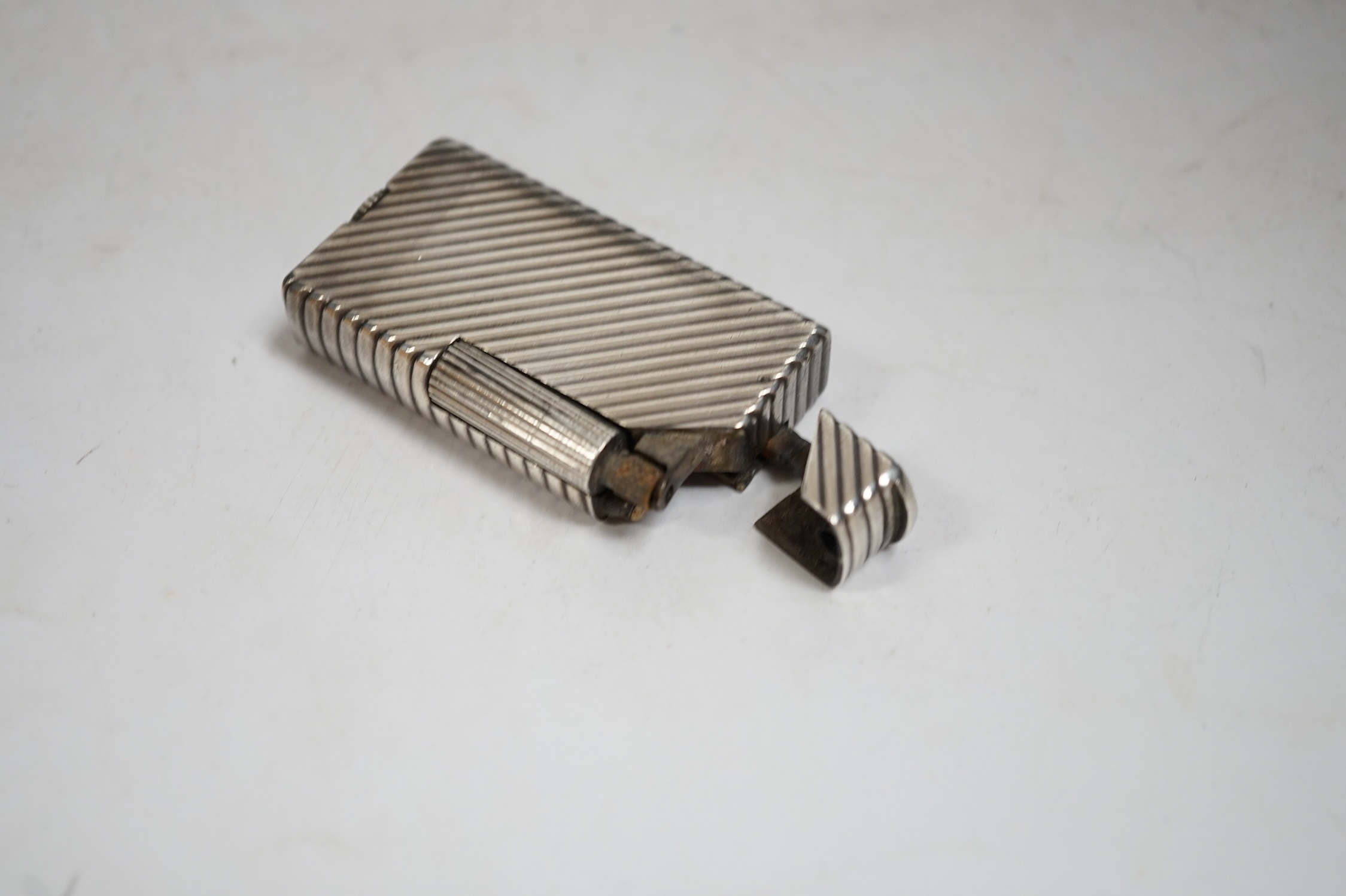 A Dunhill Rollagas lighter, 5.5cm high. Condition - fair, not working